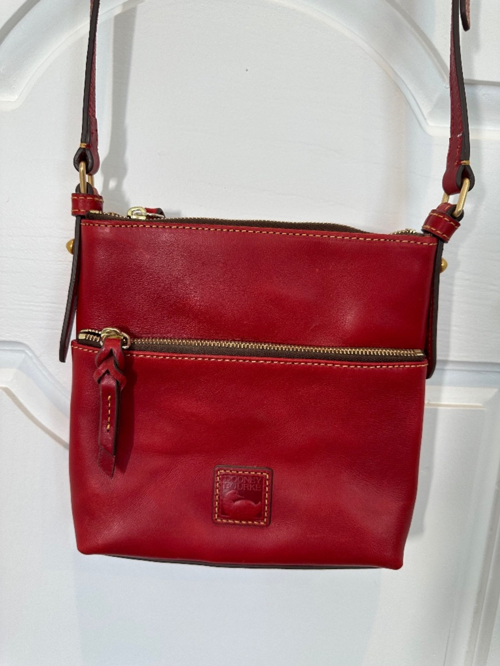 Red leather Dooney & Bourke crossbody bag